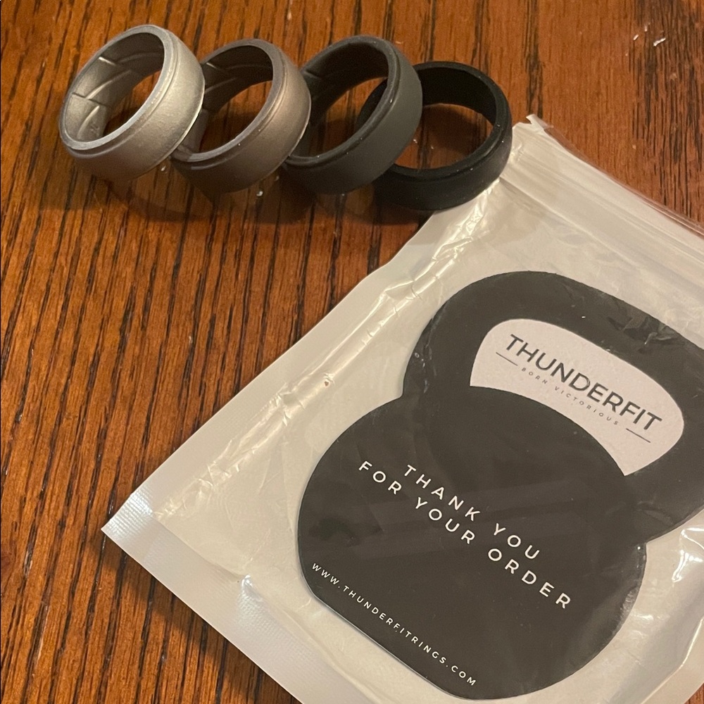 NIB ThunderFit Silicone 4 Ring Set size 16 black, dark gray, light bronze&silver